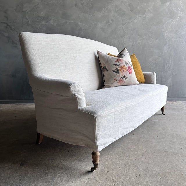 Linen Slipcovered Loveseat with Caster Wheels and High Back Profile