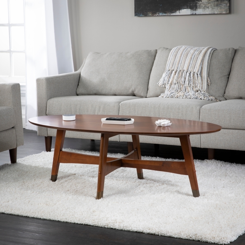 Mid-Century Oval Coffee Table with Tapered Legs and Metallic Caps
