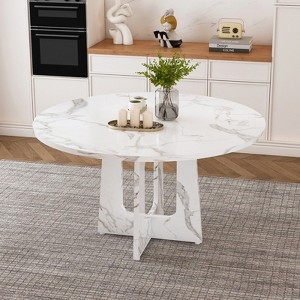 Minimalist Round Dining Table with High-Contrast Matte Black Base