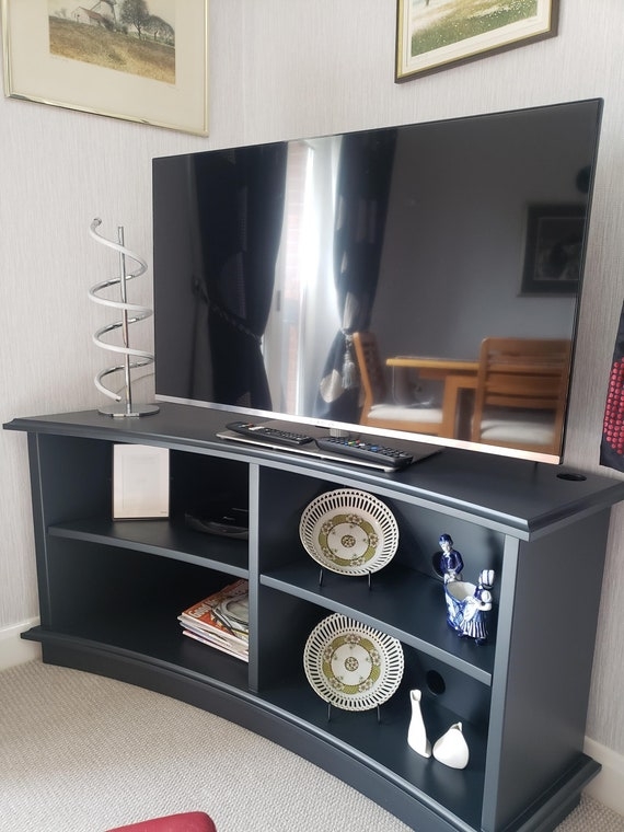 Navy Blue Corner TV Stand with Open Shelving and Curved Base