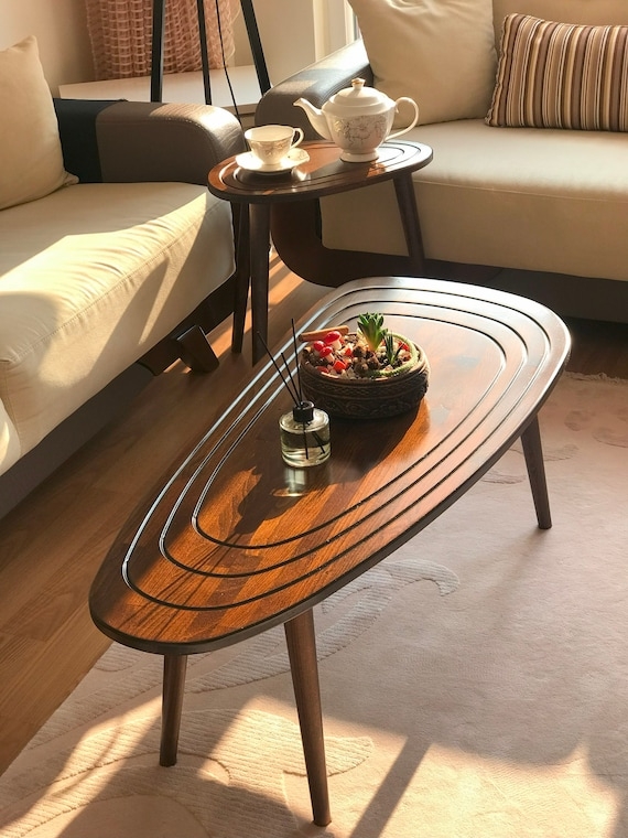 Nesting Oval Coffee Table with Concentric Grooves and Spindle Legs