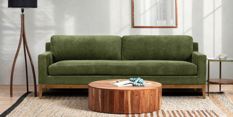 Olive Green Sofa with Distressed Velvet and a Wooden Plinth Base