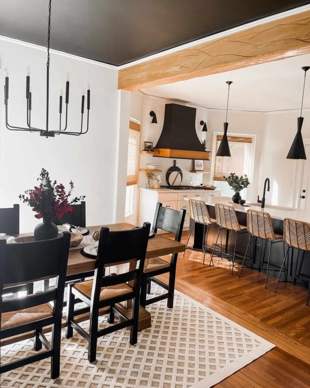 Open Concept Kitchen Dining with Black Ceiling and Wood Beam