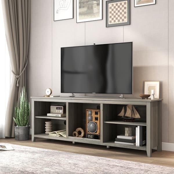 Open shelf media console in driftwood gray with six cubbies.