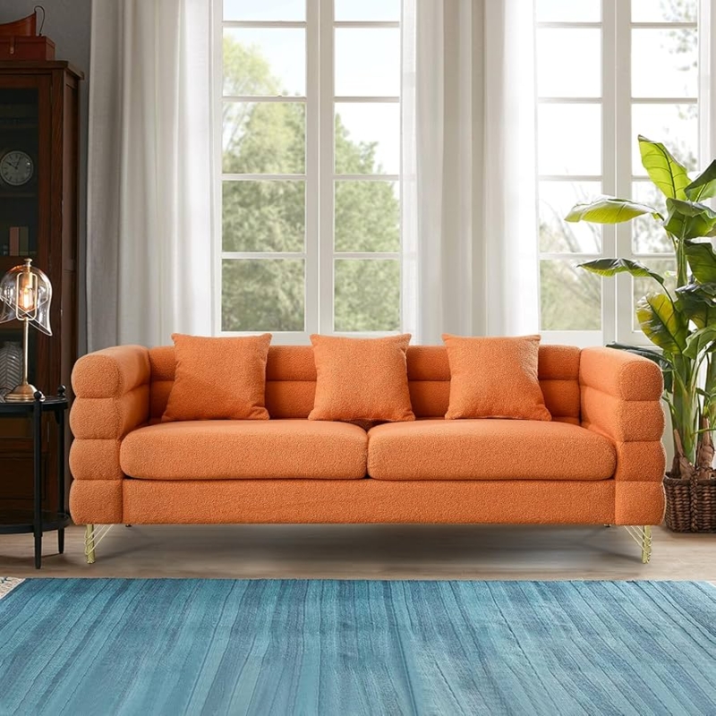 Orange Boucle Sofa with Tiered Arms and Gold Legs