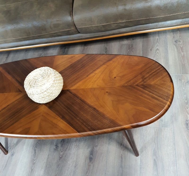 Oval Coffee Table Featuring Chevron Veneer Top and Tapered Legs