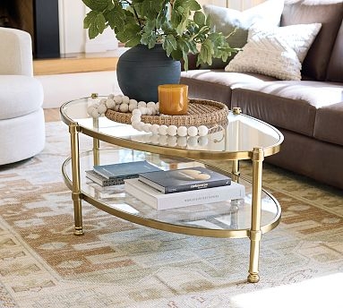 Oval Coffee Table with Two-Tier Glass Shelves and Gold Frame