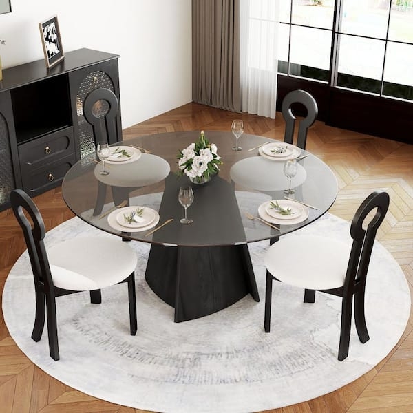 Round Dining Table Keyhole Back Chairs Sculptural Base Monochrome Style