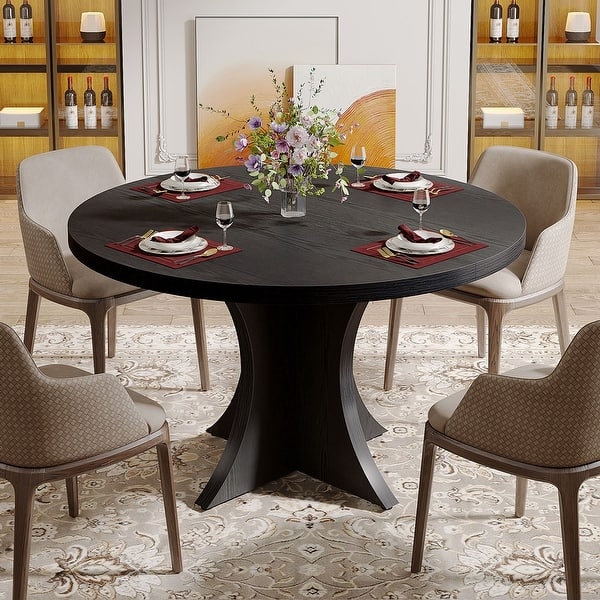 Round Dining Table with Visible Wood Grain Texture on Pedestal Base