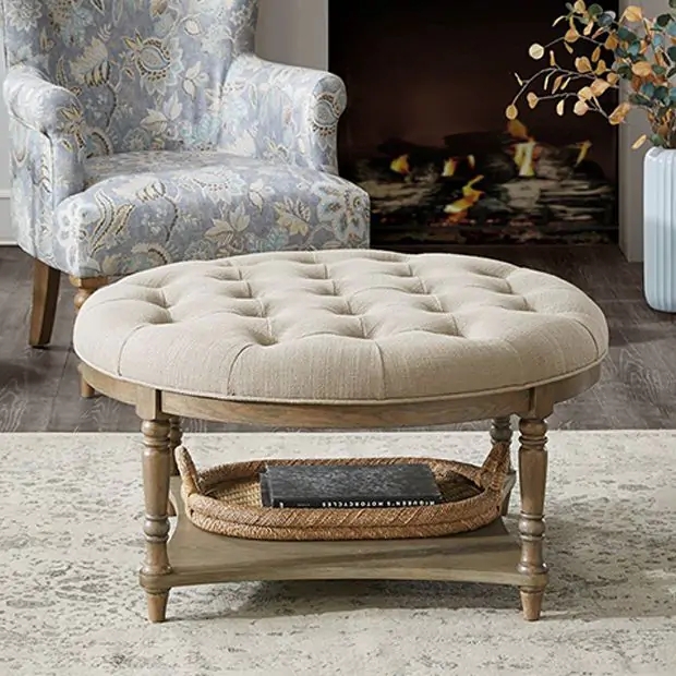 Round Ottoman with Lower Shelf Beige Tufted Top Turned Legs