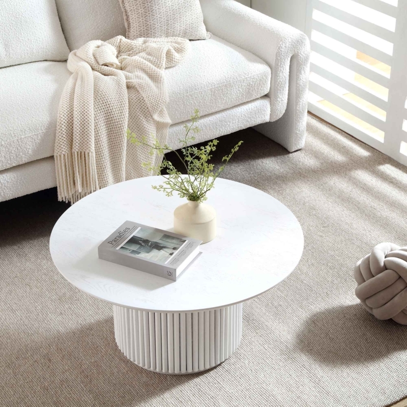 Round Whitewashed Coffee Table featuring a Ribbed Pedestal Base