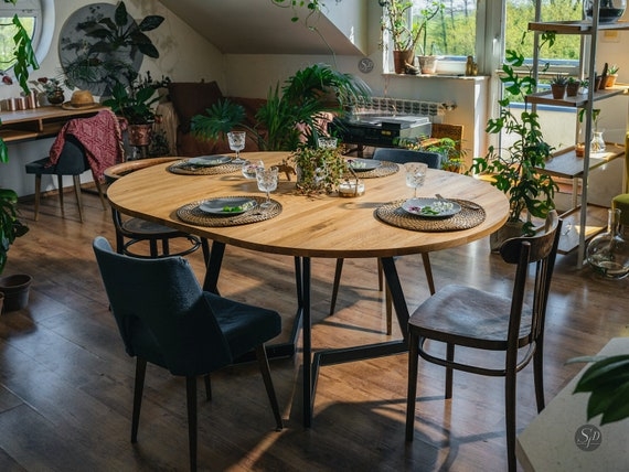 Round Wood Dining Table with Black Geometric Metal Base