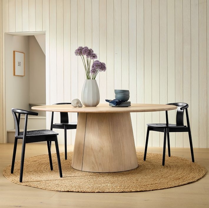 Scandinavian Round Dining Table with Black Wishbone Chairs and Pedestal