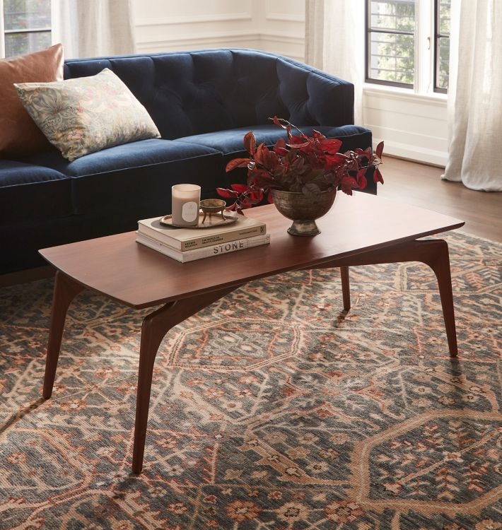 Sculpted Wood Coffee Table, Tapered Legs, Warm Walnut Tone