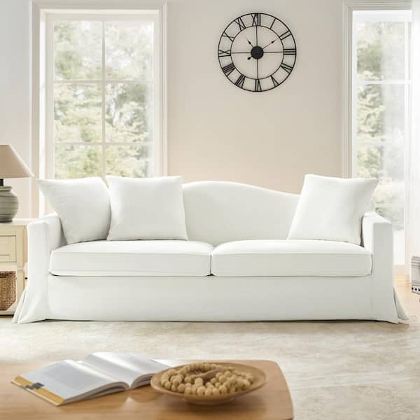 Slipcovered Sofa with Curved Back in Coastal Farmhouse Living Room
