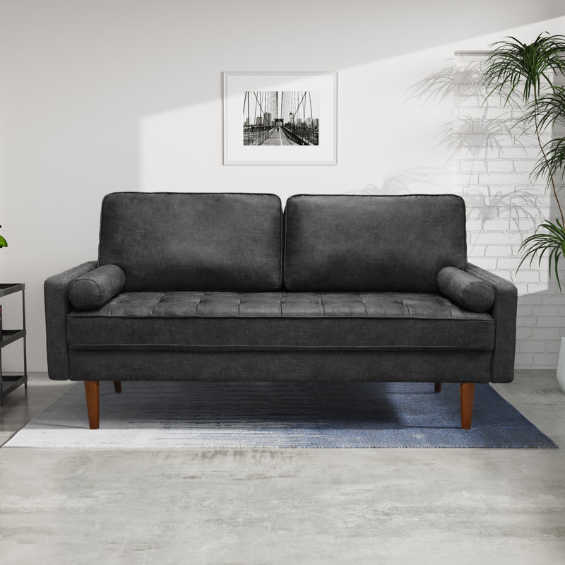 Sofa Featuring Button Tufted Seat and Tapered Wood Legs