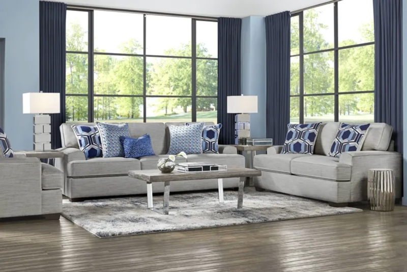 Sofa With Track Arms, Polished Chrome Legs, And Geometric Pillows