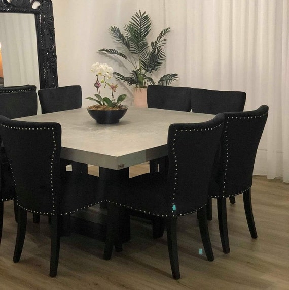 Square Concrete Dining Table with Black Nailhead Chairs