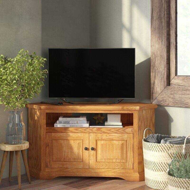 Traditional Corner Media Console with Paneled Doors and Warm Wood Grain