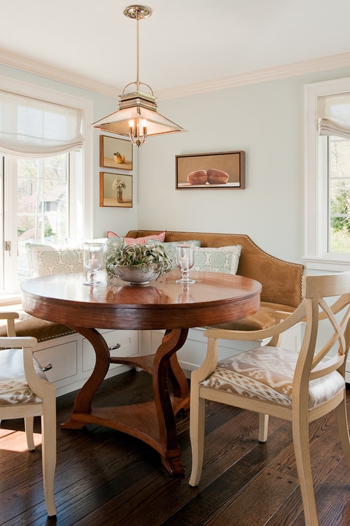 Transitional Dining Table Set with Round Pedestal and Ikat Upholstery.