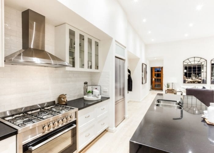Transitional Kitchen Island featuring Polished Black Granite Top