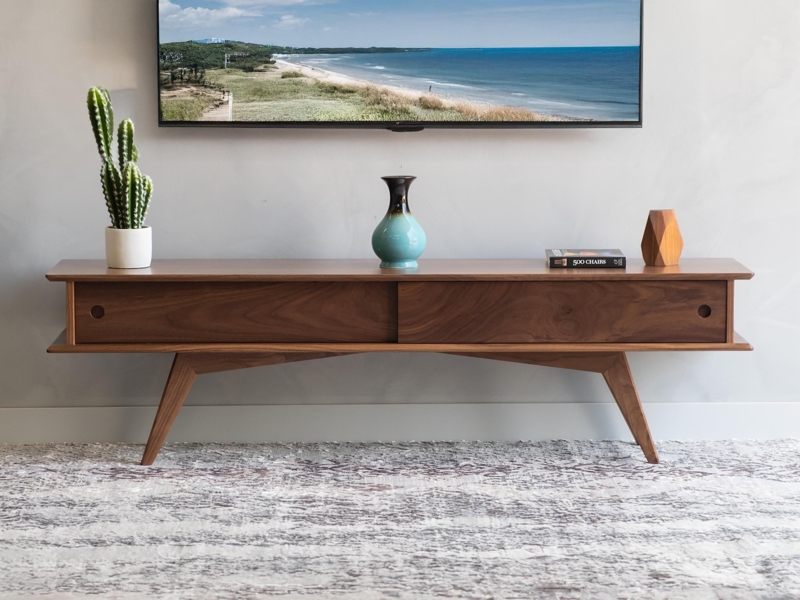 TV Console featuring Recessed Pulls, Warm Brown Walnut, Sliding Doors.