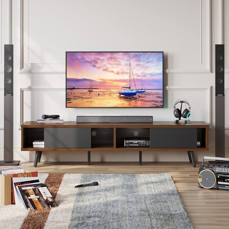 Walnut and gray TV stand with sliding doors and tapered legs.