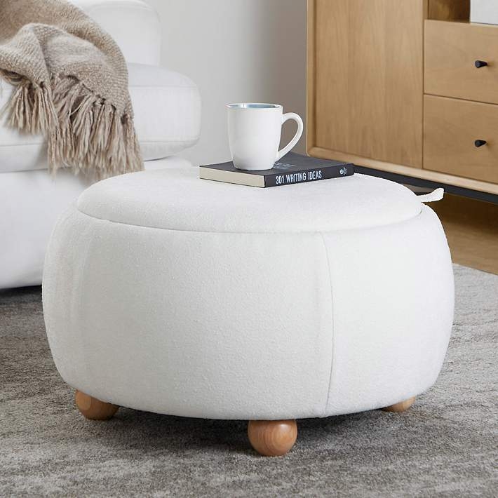 White Boucle Round Ottoman resting on playful Wooden Ball Feet accents