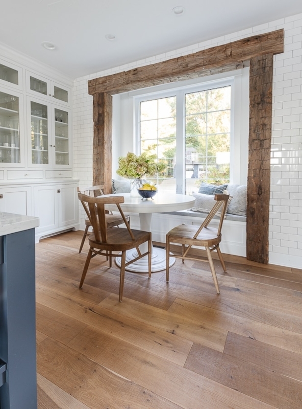 White Round Pedestal Table paired with Classic Wood Spindle Back Chairs.