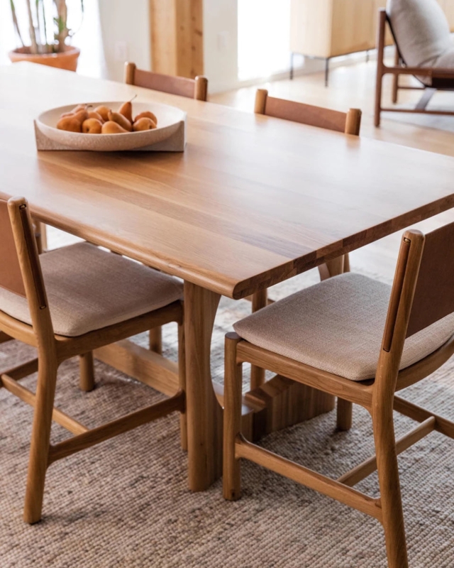 Wood Dining Table with Curved Legs and Mixed Material Chairs
