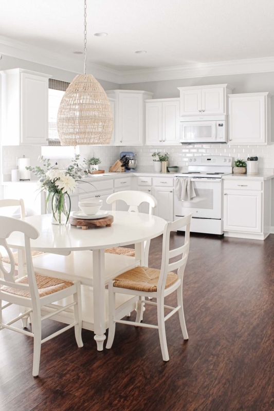 Wood-Toned Cross-Back Counter Stools in Transitional White Kitchen
