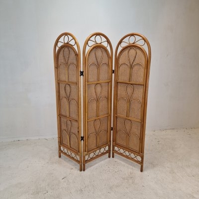 Arched Rattan Folding Screen featuring Stylized Floral Loops
