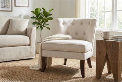 Armless Accent Chair with Button Tufted Back and Espresso Legs.