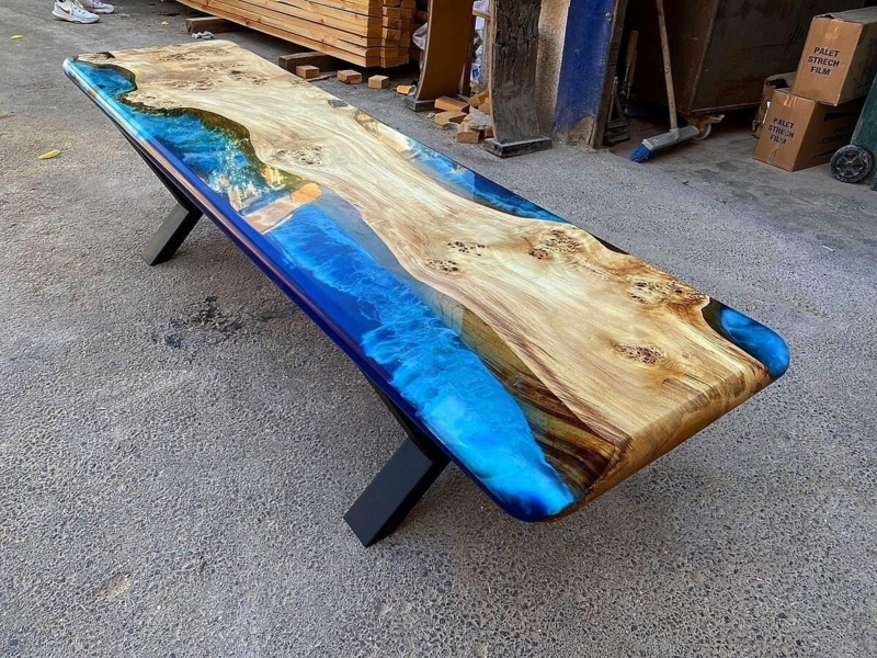 Bench featuring Blue Epoxy River and Live Edge Wood with X-Frame Legs