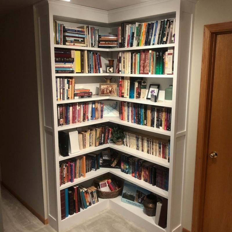Bookcase Built-In with Open Corner Design and Integrated Baseboard