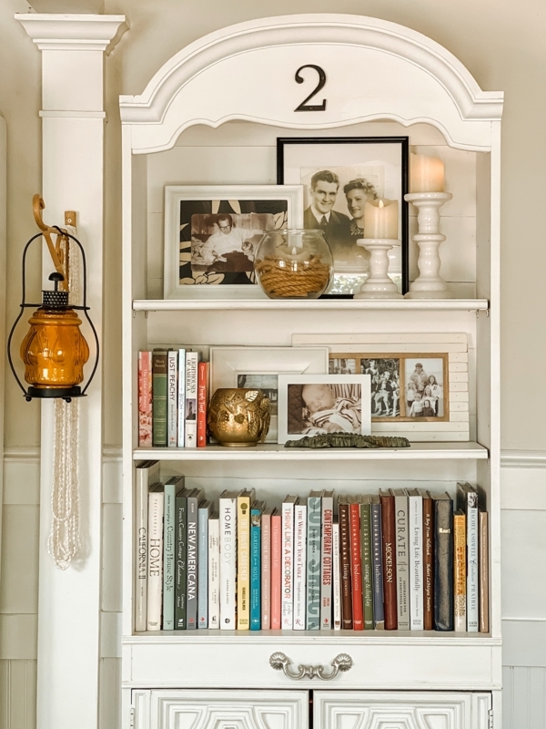 Bookcase Paneled Back Built-In Design White Woven Baskets Coastal