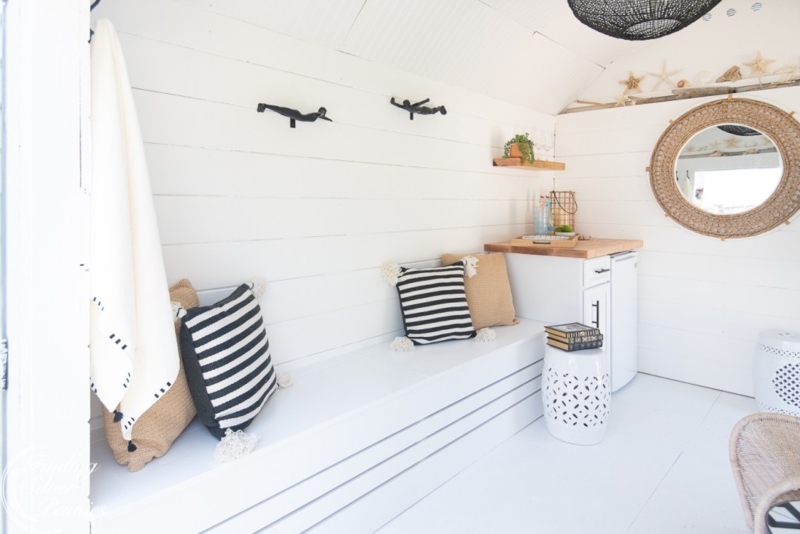 Built-in Bench with Slatted Base and Striped Pillows