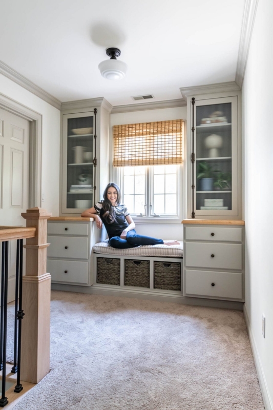 Built-In Bookcase with Reeded Glass Doors and Integrated Window Seat
