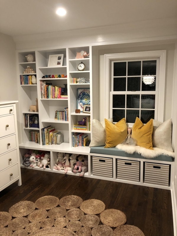 Floor to Ceiling Library Shelving with Integrated Window Bench
