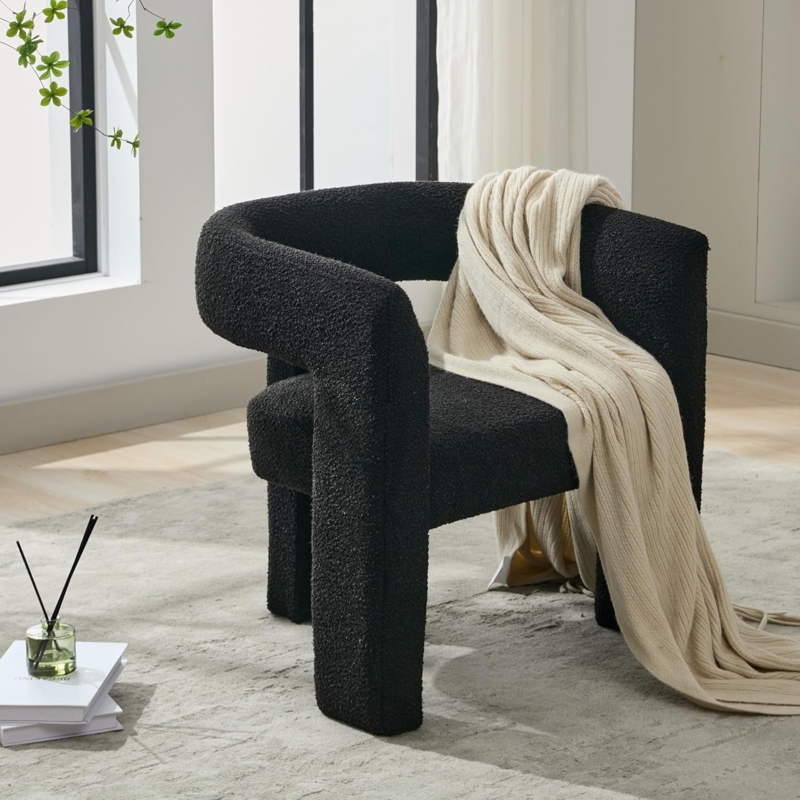 Minimalist Barrel Chair in Black Boucle styled against Slat Wall