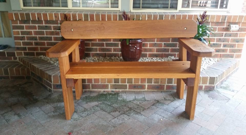 Outdoor Bench in Rustic Style with Chunky Wood Frame and High Arms