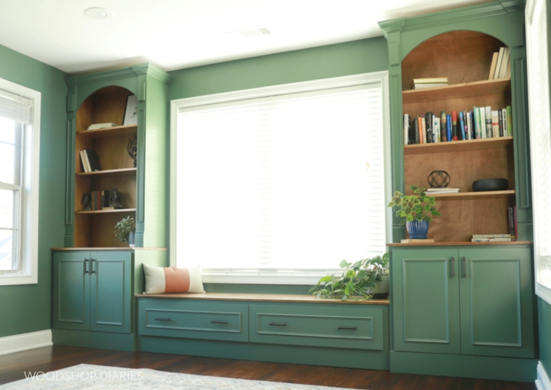 Sage Green Arched Bookcases with Window Seat Storage