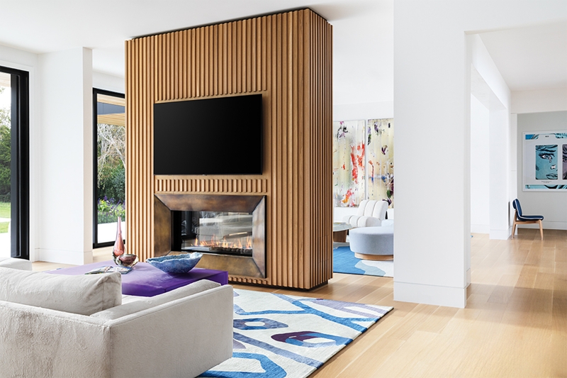 Slatted Wood Room Divider Wall with Integrated Fireplace