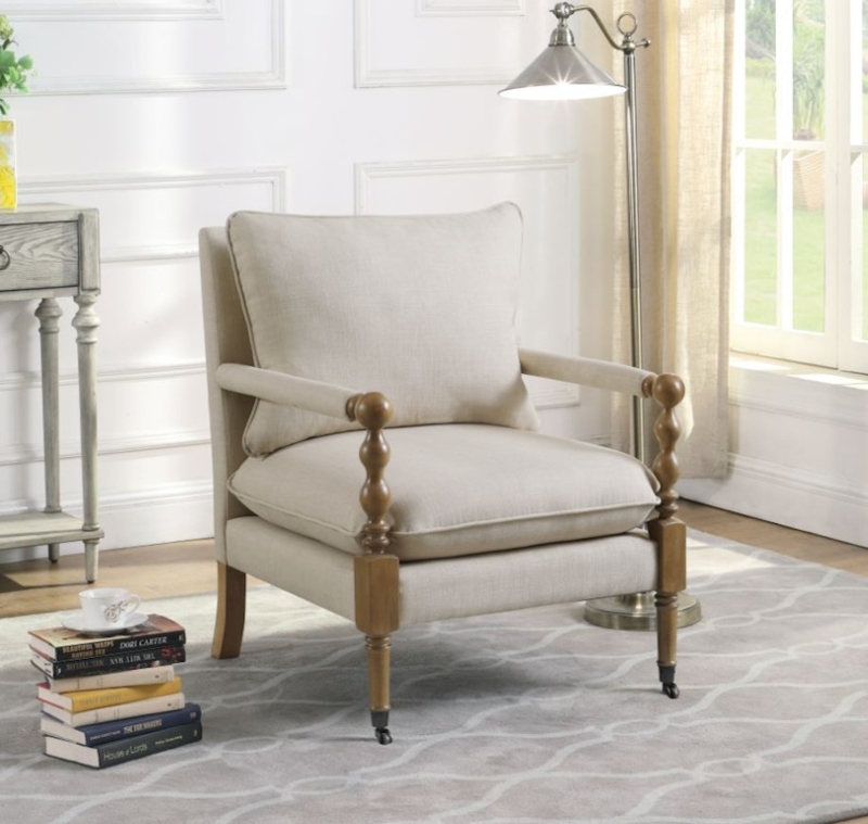 Traditional Accent Chair with Front Casters and Nailhead Trim.