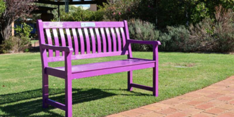 Traditional Garden Bench with Slatted Wood Construction and Armrests