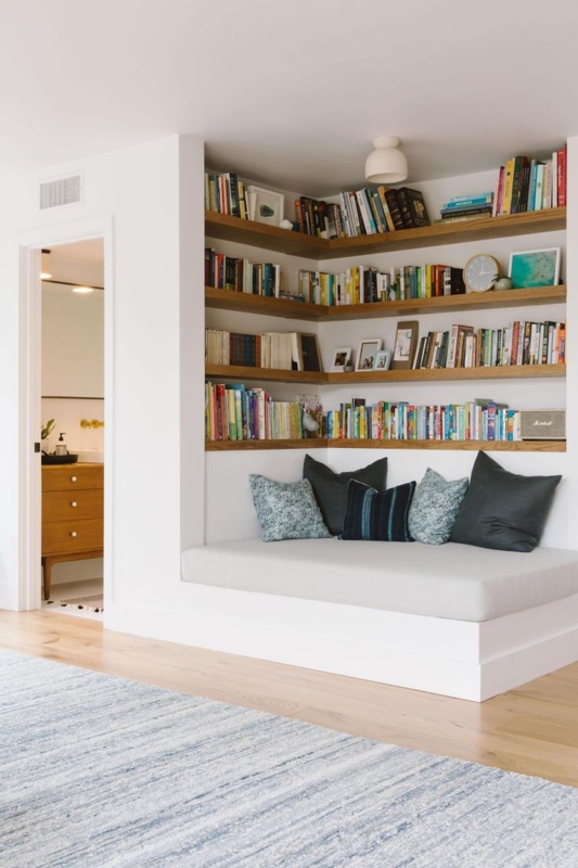 White Built-in Mudroom Bench with Slat Back Detail and Shelving