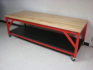 Workbench with Red Metal Frame, Mobile Base, Butcher Block Surface.