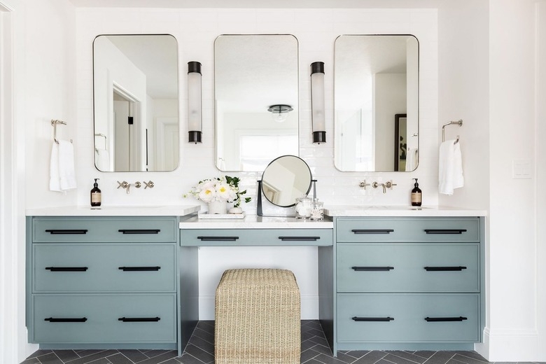 Bathroom Vanity, Marble Top, Round Gold Mirror, Brass Hardware, Seated Area.