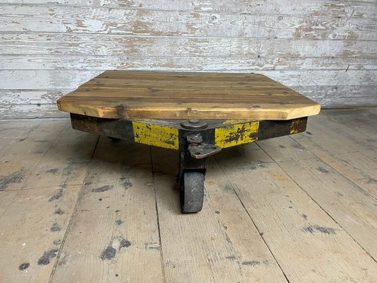 Coffee Table Slatted Wood Top Oversized Wheels Exposed Hardware