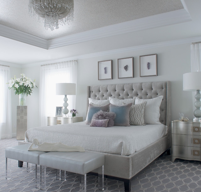 Cream Bed With Deep Button Tufting And Mirrored Bedside Tables